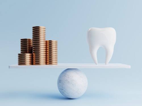 Stacks of coins balanced against tooth