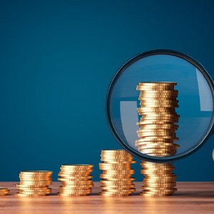 Stacks of coins examined with magnifying glass