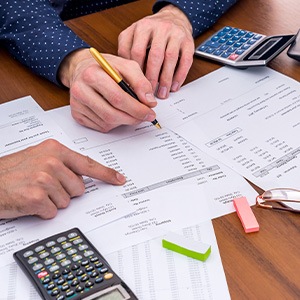 Delray Beach patient filling out paperwork for Invisalign financing