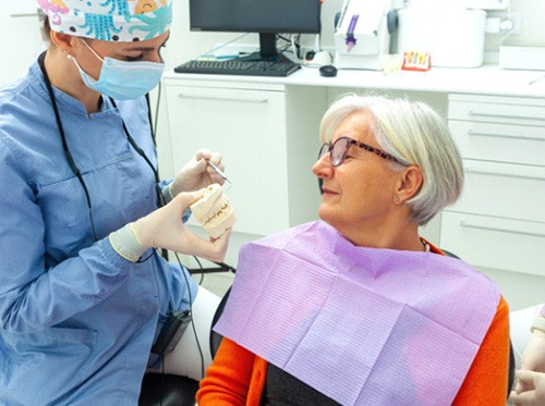 Senior patient talking to dentist during consultation