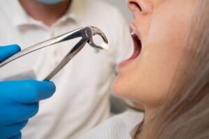 Woman getting a tooth extracted